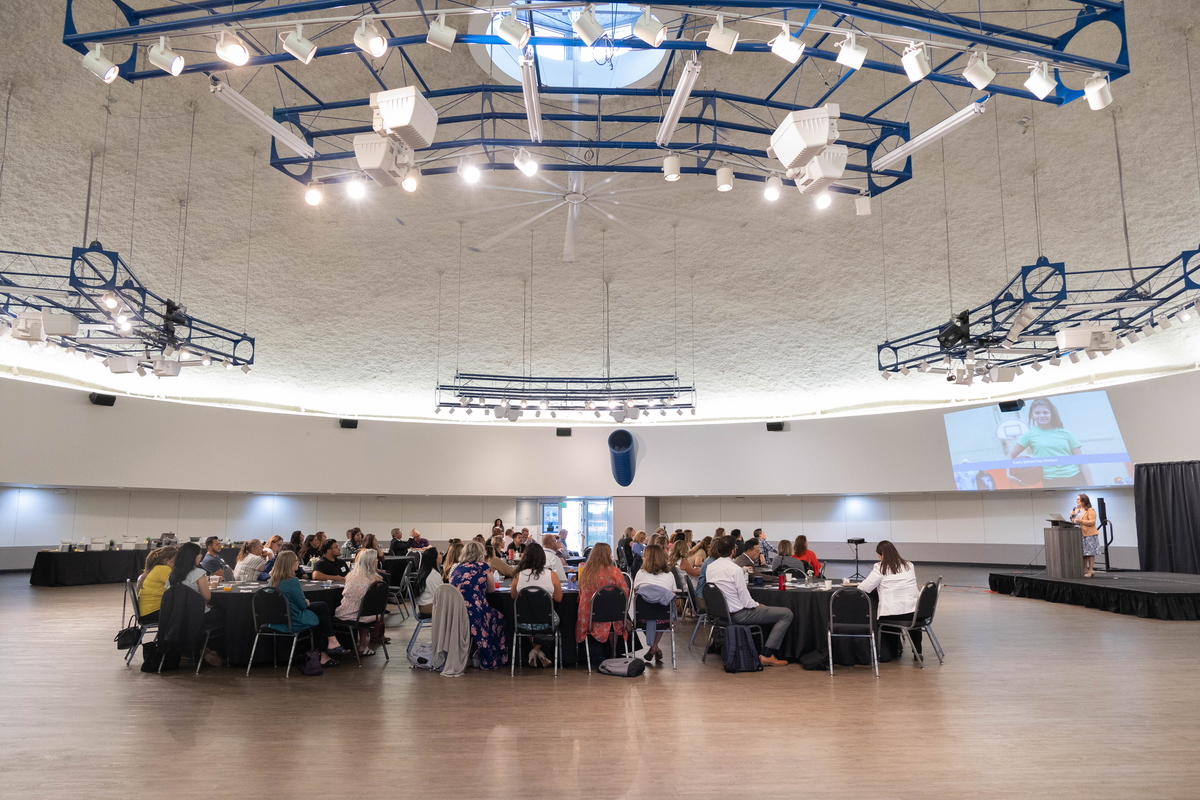 Wide view of the audience inside Waymire Dome.