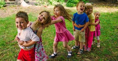 children playing outside in a congo line